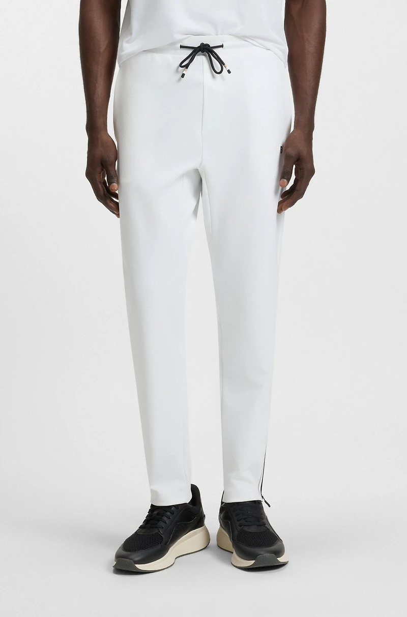 Active stretch-gabardine tracksuit bottoms with thermoregulating technology