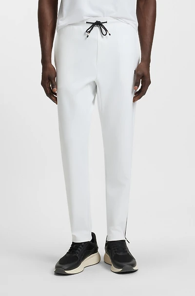 Active stretch-gabardine tracksuit bottoms with thermoregulating technology