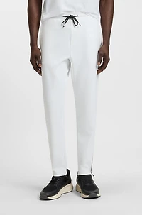 Active stretch-gabardine tracksuit bottoms with thermoregulating technology