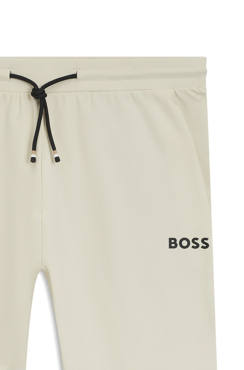 Active stretch-gabardine tracksuit bottoms with thermoregulating technology