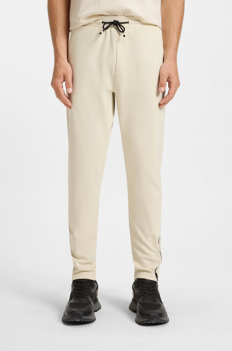Active stretch-gabardine tracksuit bottoms with thermoregulating technology