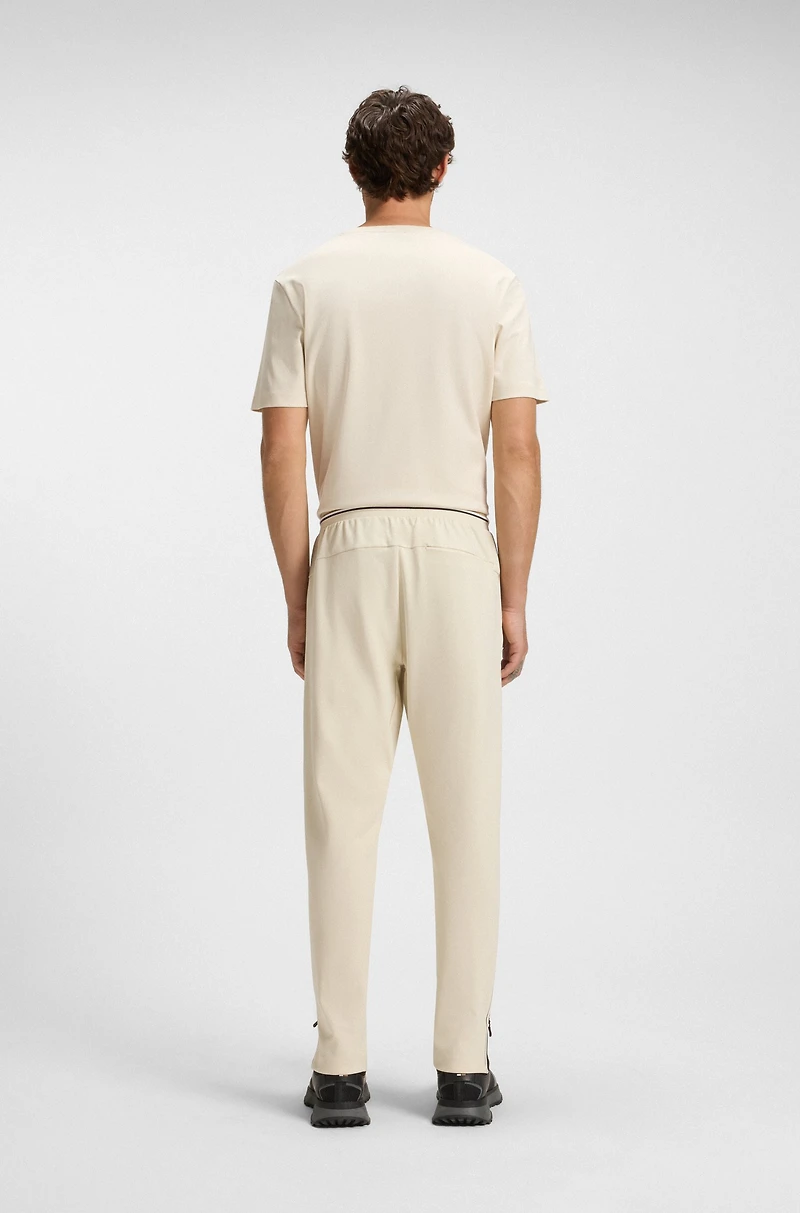 Active stretch-gabardine tracksuit bottoms with thermoregulating technology
