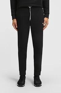 Cotton tracksuit bottoms with striped trims