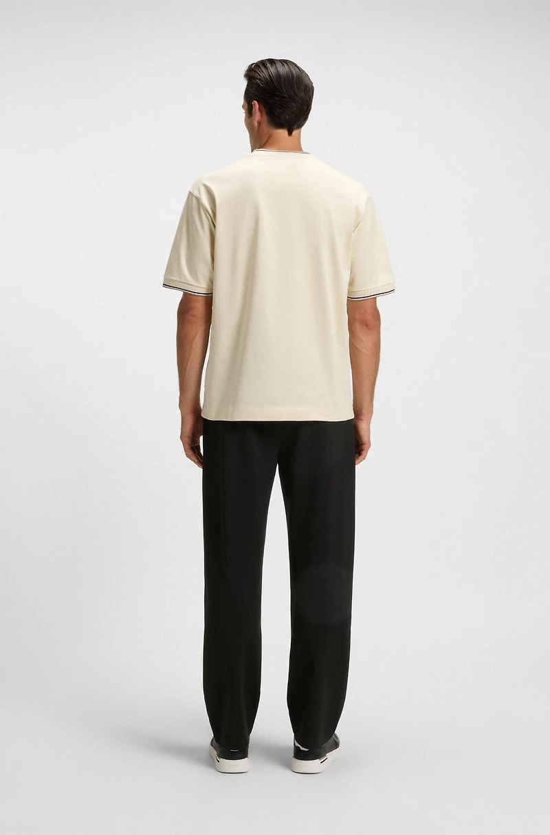 Tracksuit bottoms with patterned drawcord