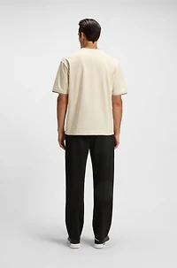 Tracksuit bottoms with patterned drawcord