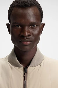 Water-repellent gilet with tonal binding