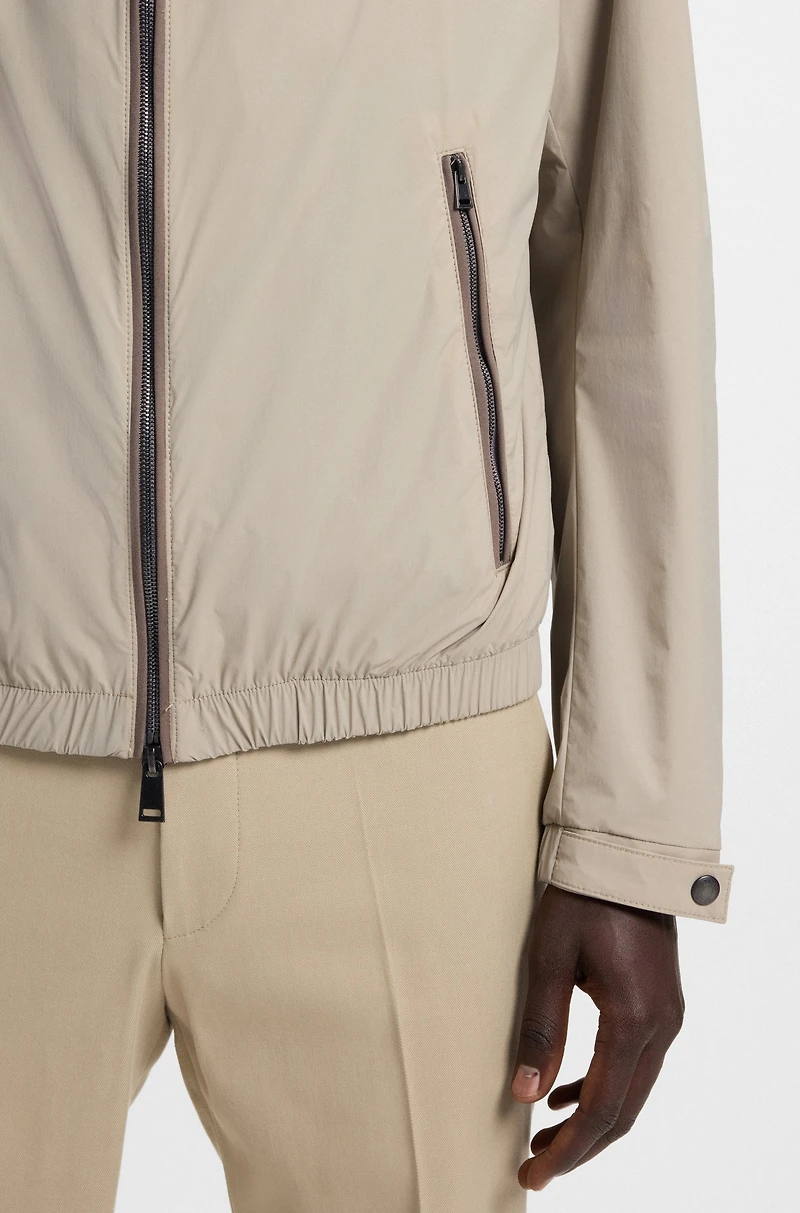 Water-repellent windbreaker with packable hood