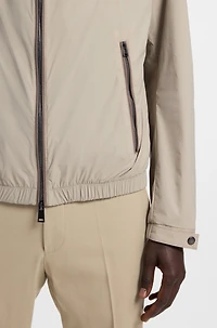 Water-repellent windbreaker with packable hood