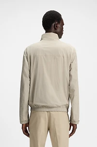 Water-repellent windbreaker with packable hood
