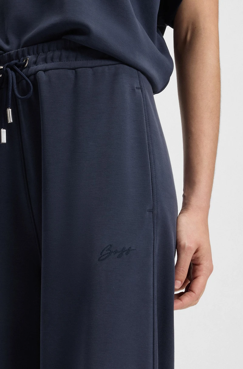 Relaxed-fit tracksuit bottoms with embroidered logo