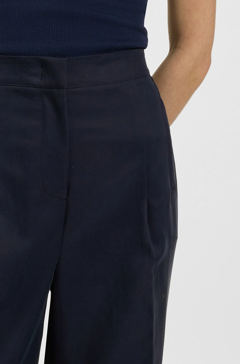 Formal trousers with pleat details