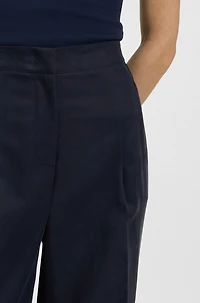 Formal trousers with pleat details