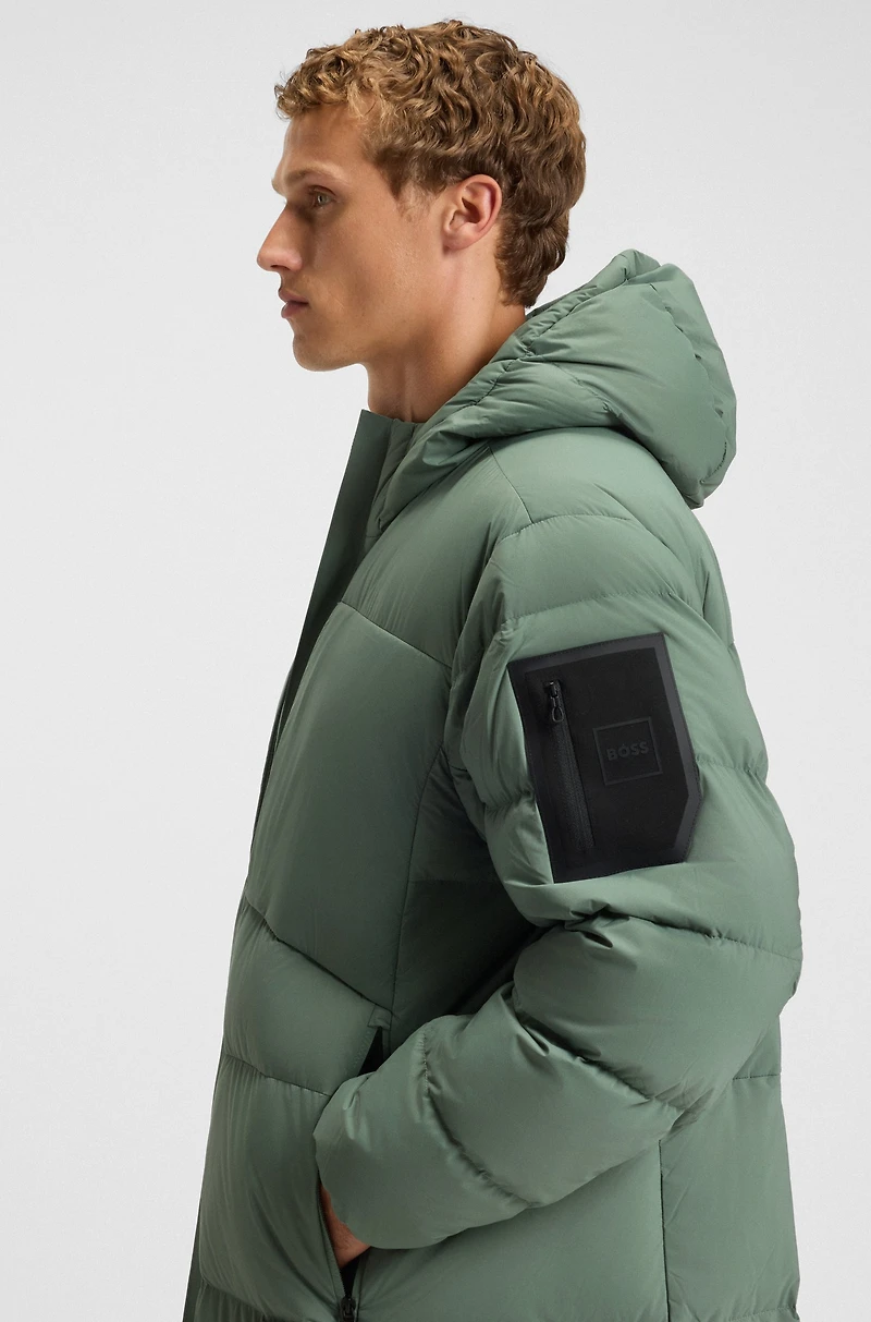 Down-filled long jacket with water-repellent finish
