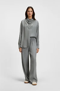 Oversize-fit blouse with logos and fringing