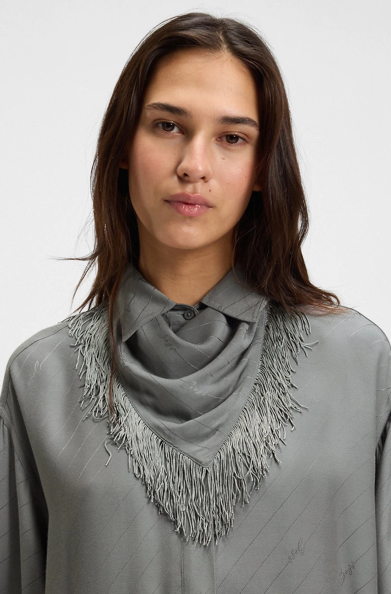 Oversize-fit blouse with logos and fringing