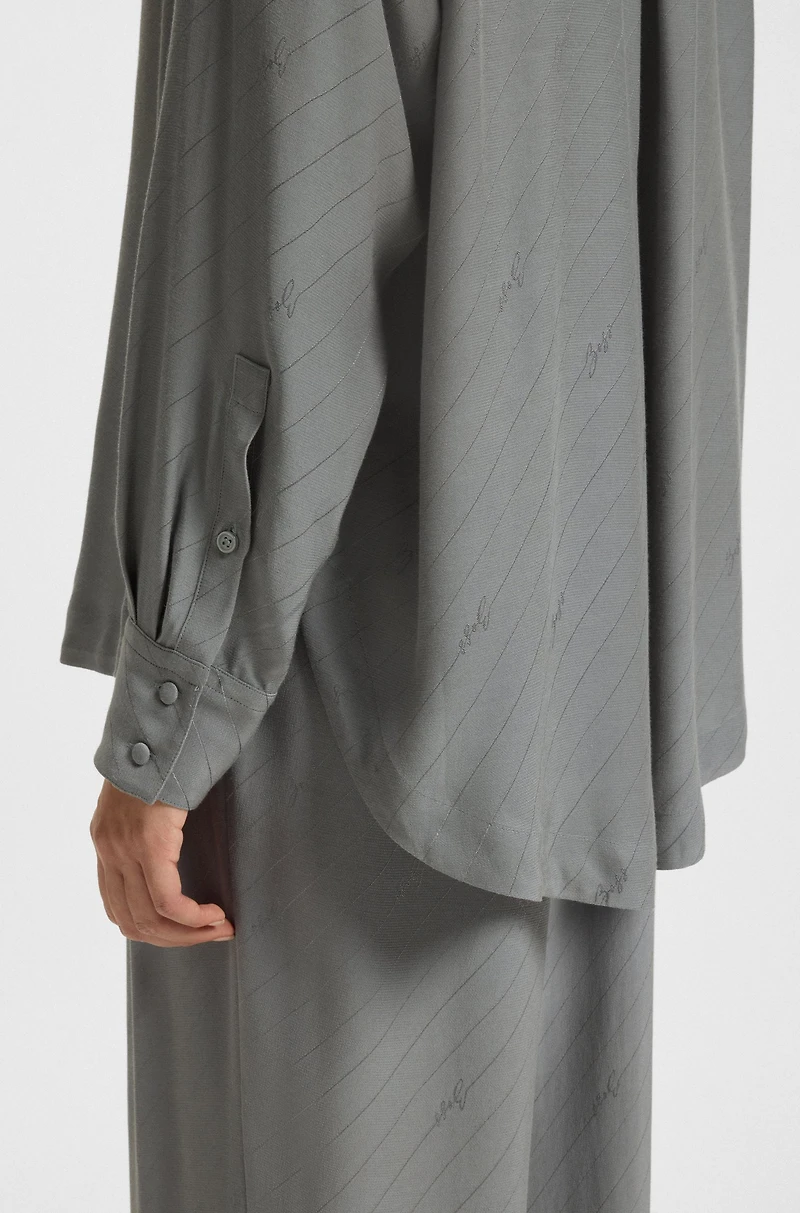 Oversize-fit blouse with logos and fringing