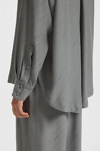 Oversize-fit blouse with logos and fringing