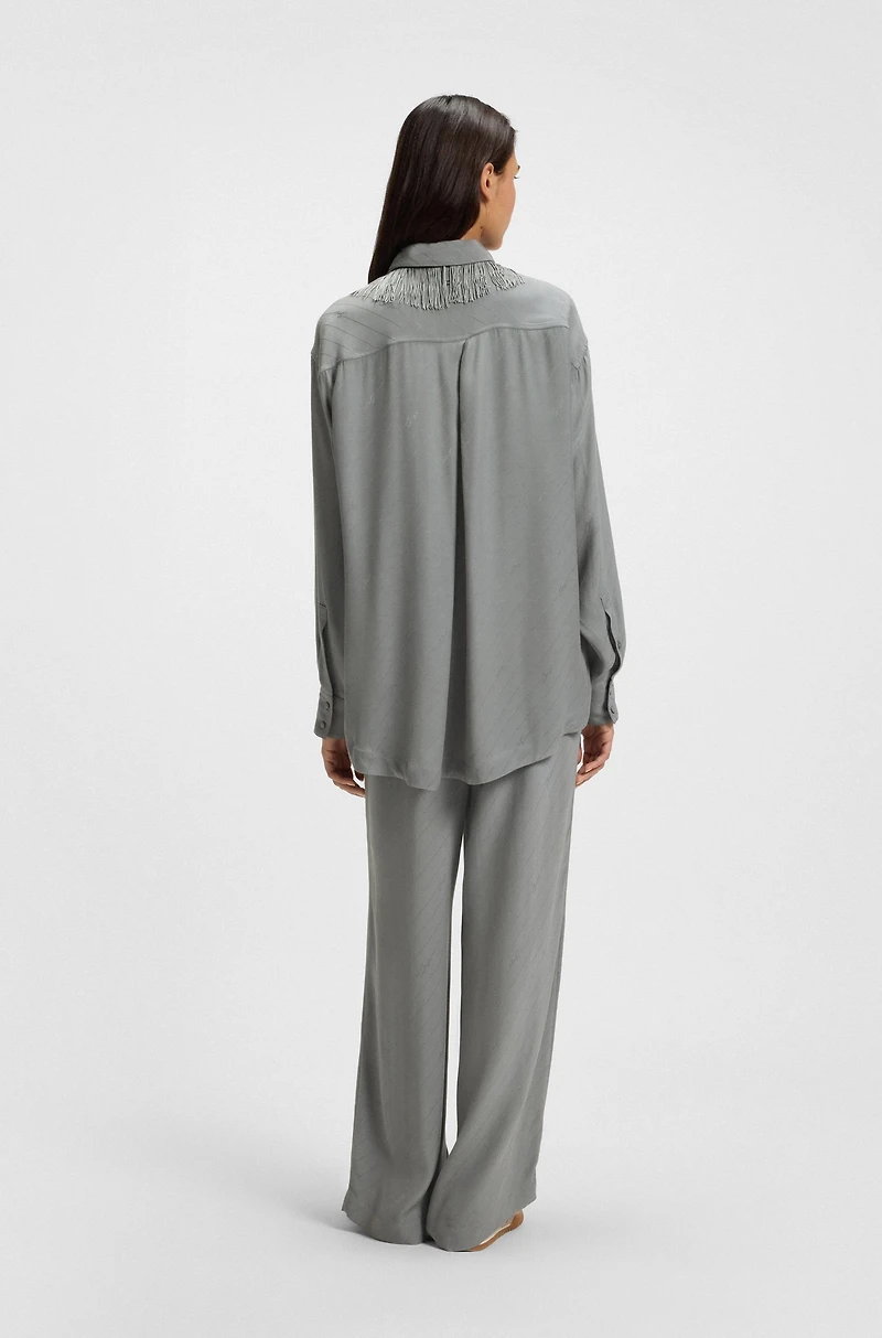 Oversize-fit blouse with logos and fringing