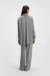 Oversize-fit blouse with logos and fringing