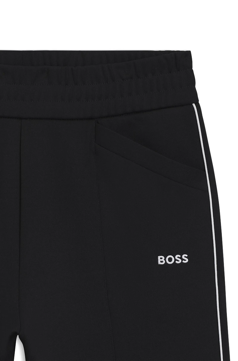 Straight-fit tracksuit bottoms with contrast logo and piping