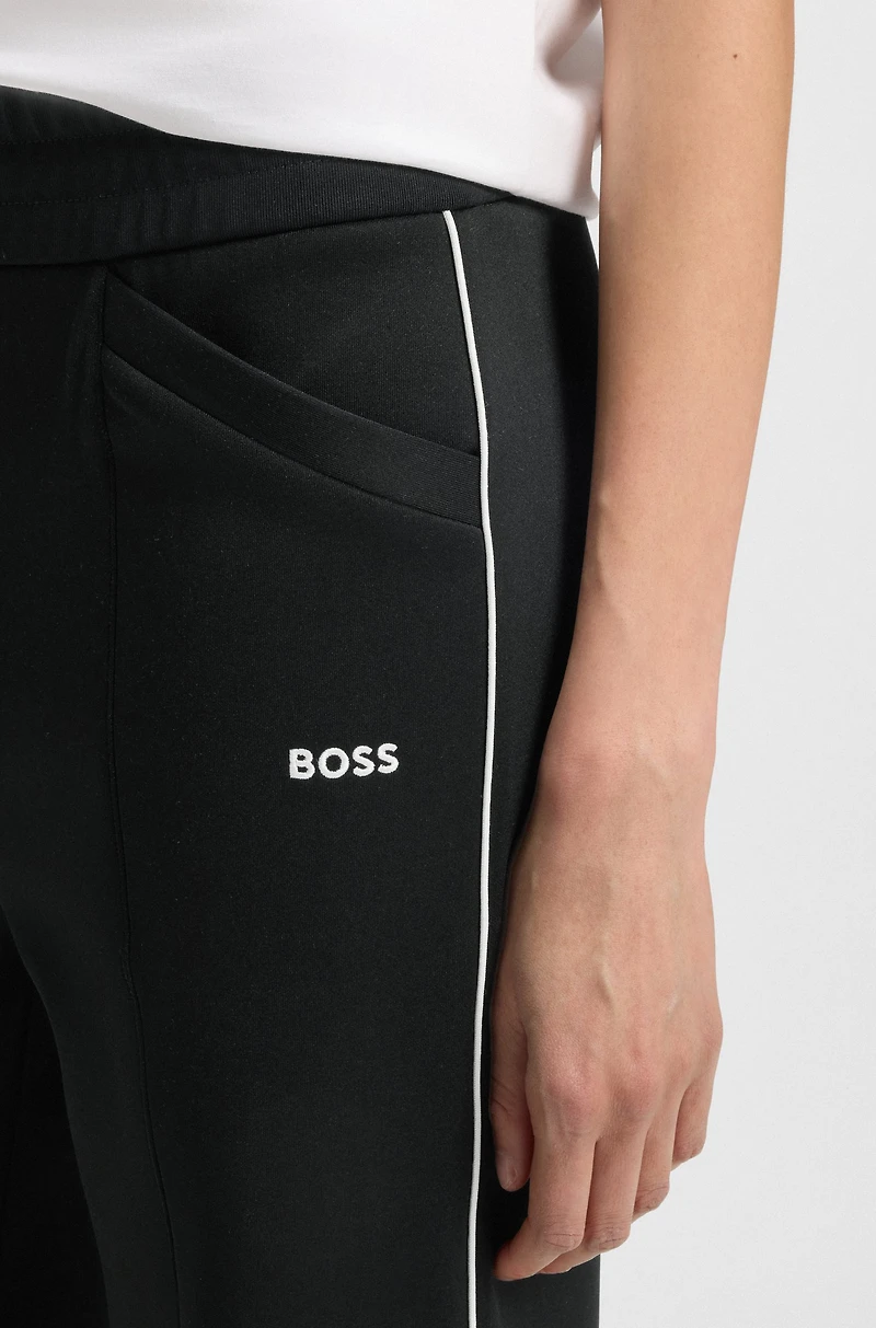 Straight-fit tracksuit bottoms with contrast logo and piping