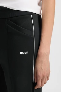 Straight-fit tracksuit bottoms with contrast logo and piping