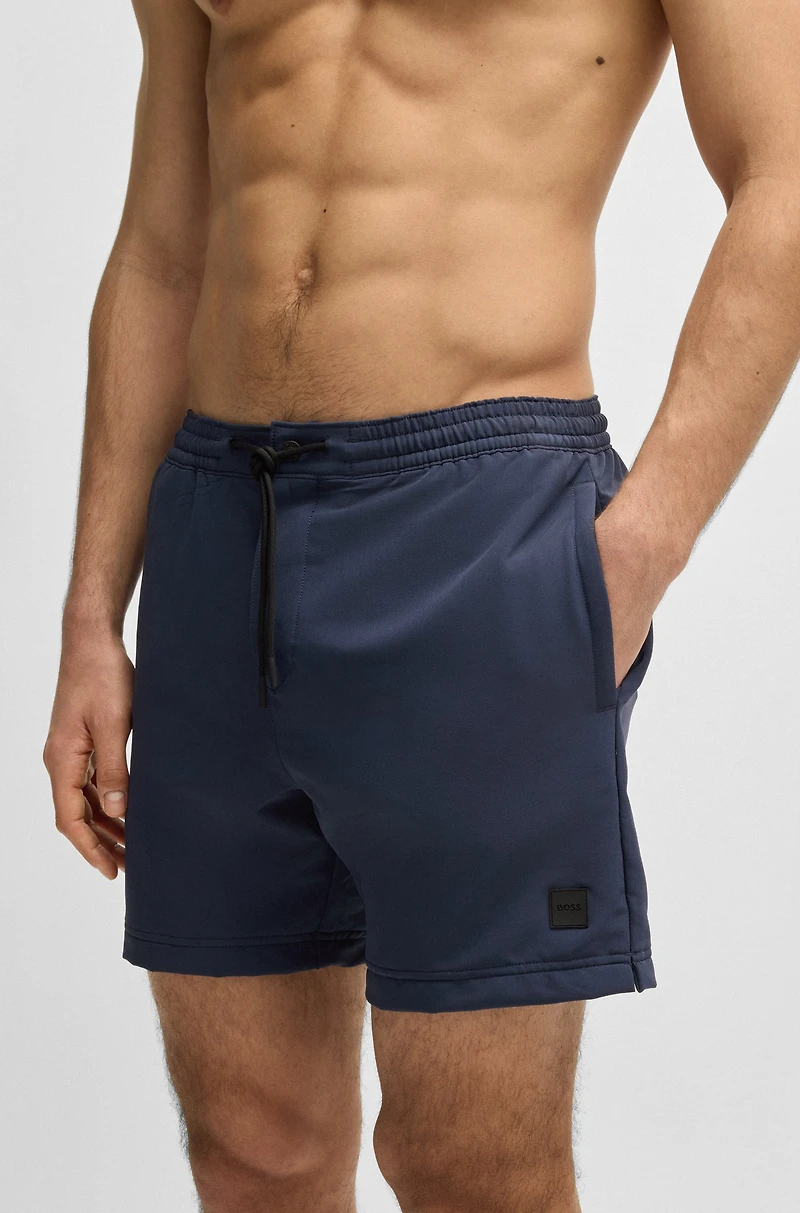 Packable swim shorts with logo badge