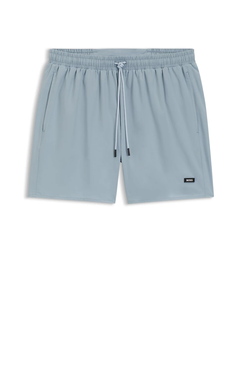 Swim shorts with rubber logo badge