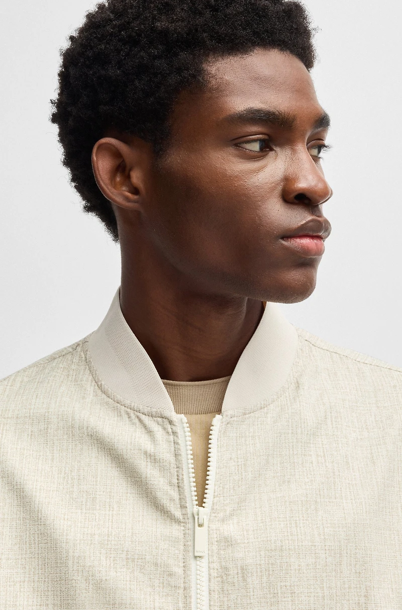 Water-repellent packable jacket with two-way zip