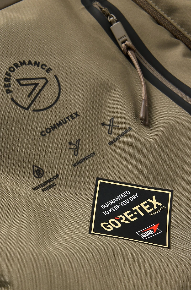 Water-repellent coat with detachable bib