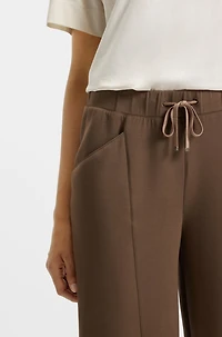 Lustrous-piping tracksuit bottoms a relaxed fit