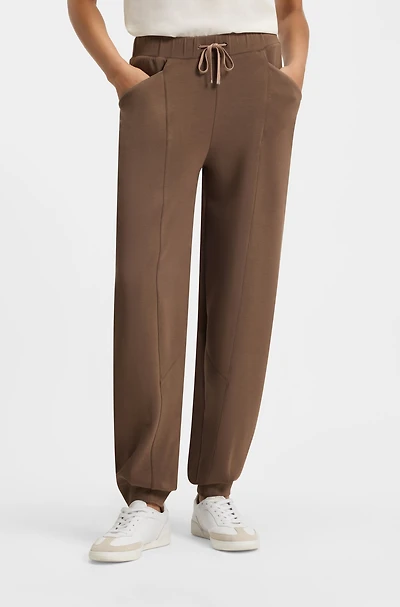 Lustrous-piping tracksuit bottoms a relaxed fit