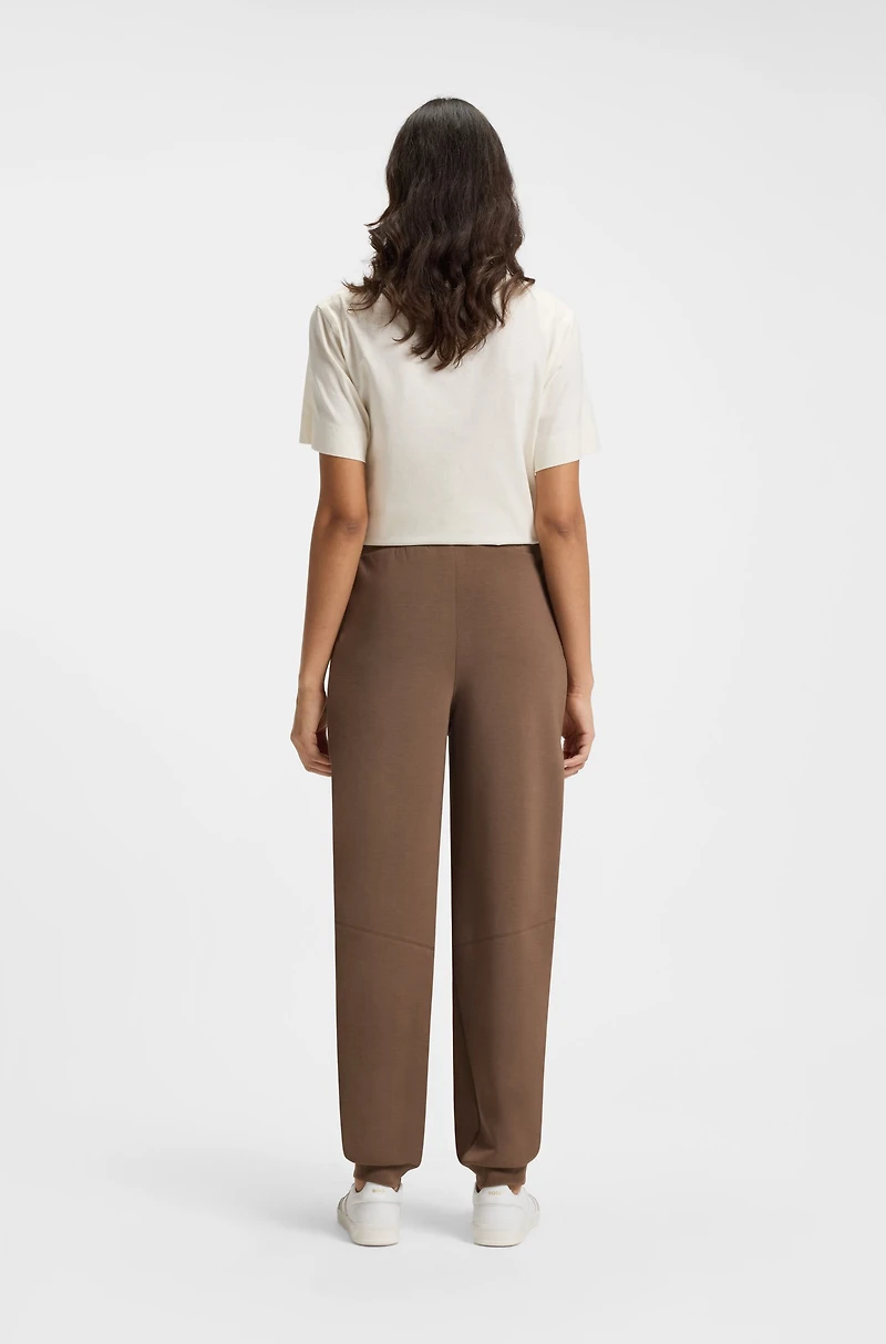 Lustrous-piping tracksuit bottoms a relaxed fit