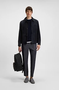 Backpack with smooth and structured finishes