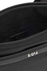 Reporter bag with smooth and structured finishes