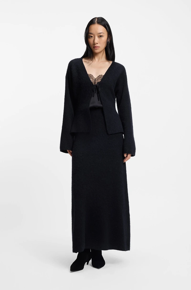 Knitted skirt with logo charm