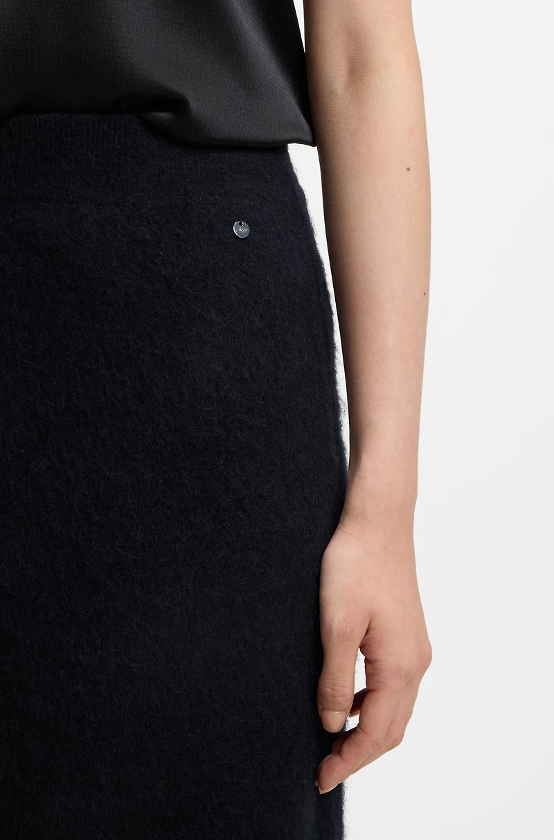 Knitted skirt with logo charm