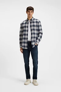 Blue tapered-fit jeans soft-motion denim