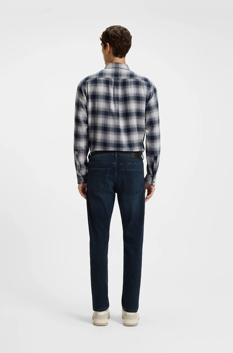 Blue tapered-fit jeans soft-motion denim