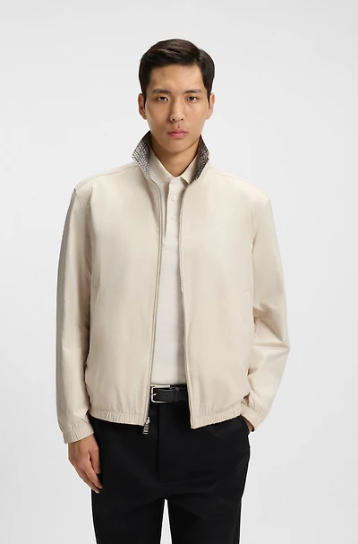 Water-repellent reversible jacket with check pattern