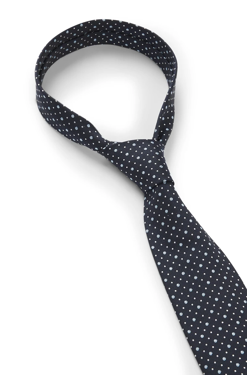 Dot-motif tie in a silk blend