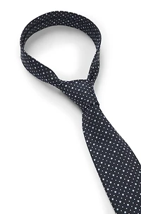 Dot-motif tie in a silk blend
