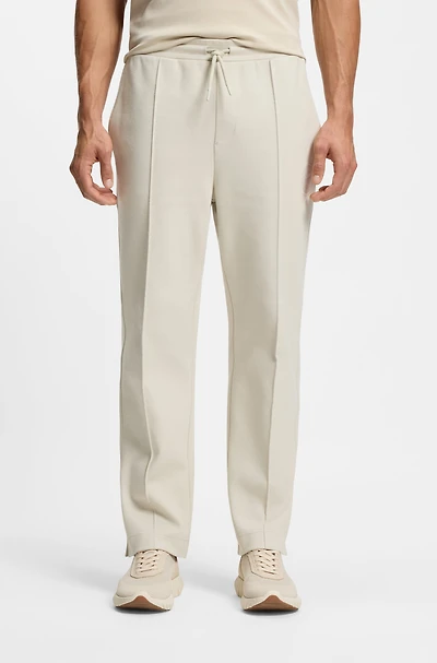 Cotton-blend tracksuit bottoms with tennis-themed logo