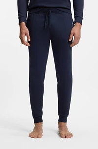 Cotton-terry tracksuit bottoms with logo and stripes