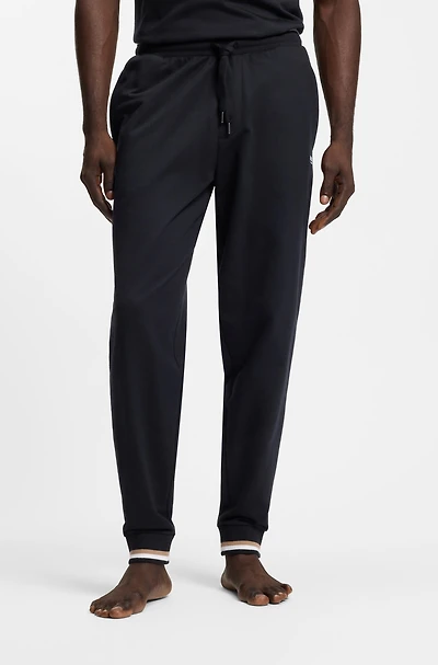Cotton-terry tracksuit bottoms with signature stripes and logo