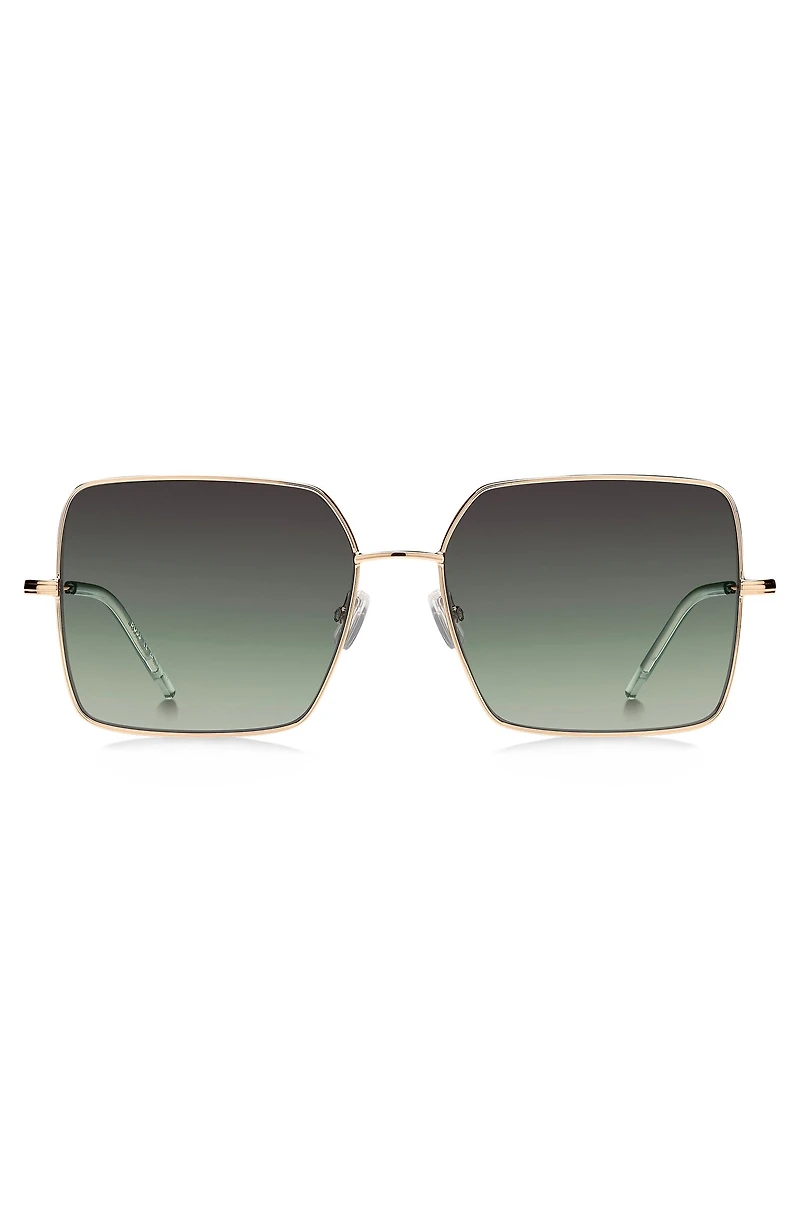 Gold-tone sunglasses with green end-tips