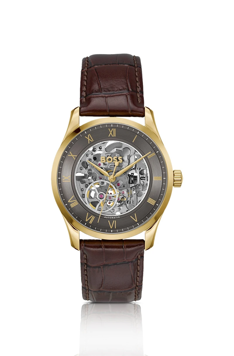 Gold-tone automatic watch with skeleton dial