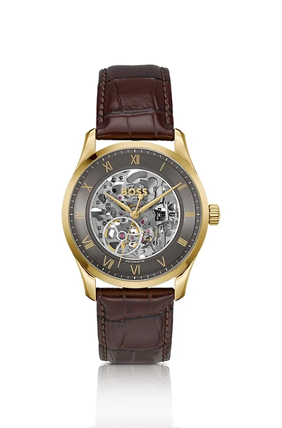 Gold-tone automatic watch with skeleton dial