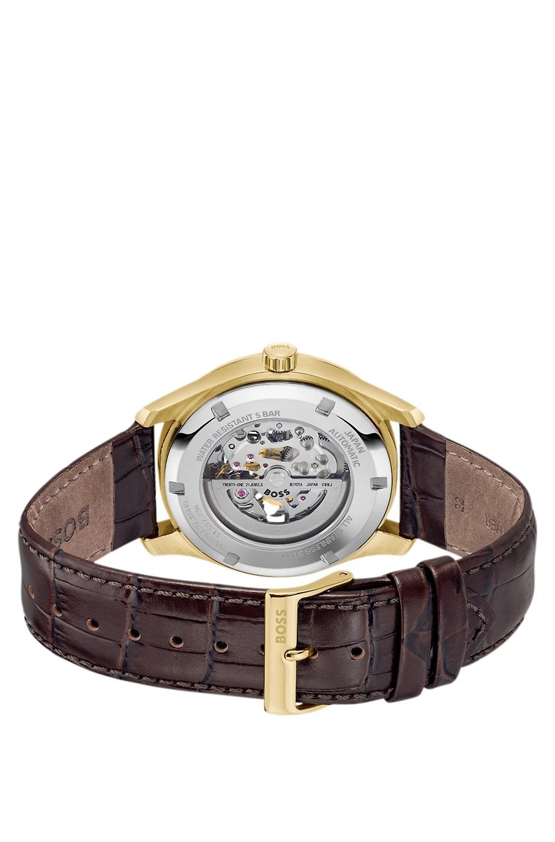 Gold-tone automatic watch with skeleton dial