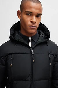 Equestrian hooded puffer jacket with fleece-lined pockets